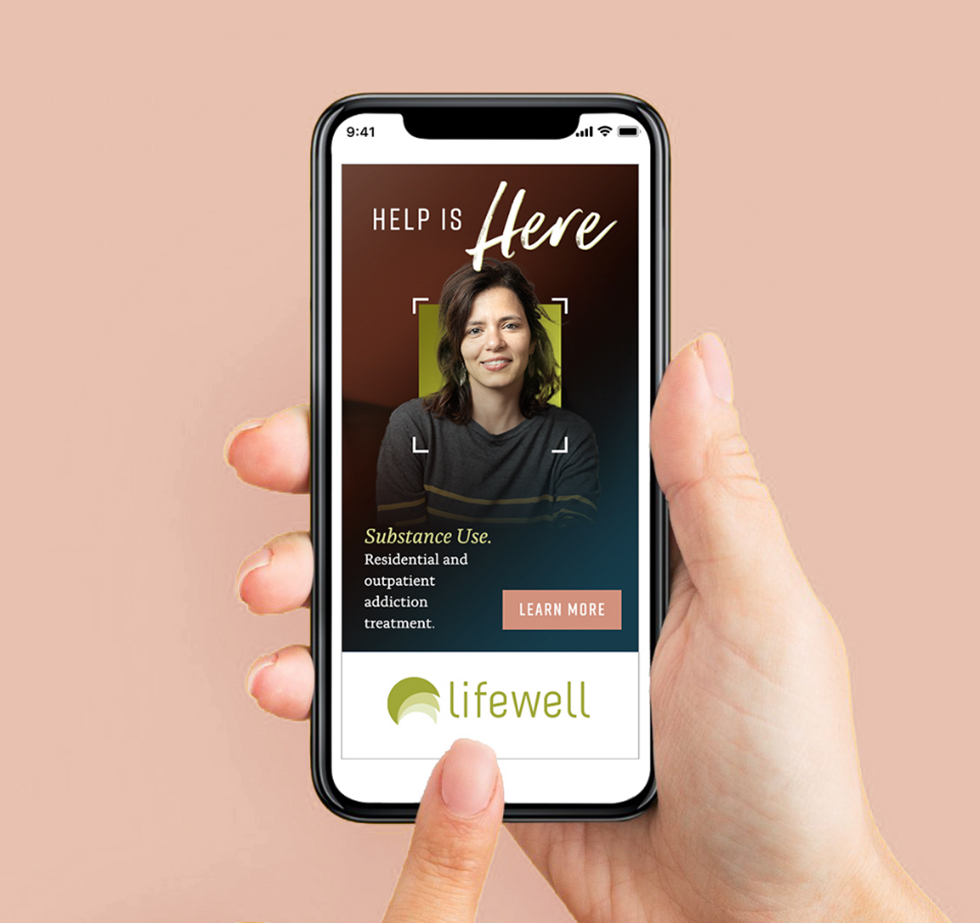 lifewell-holding-cell-phone